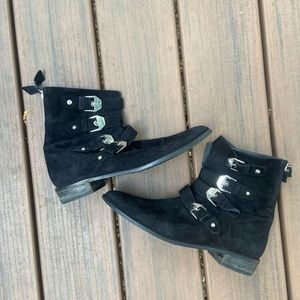 Black Stuart Weitzman booties with silver buckles